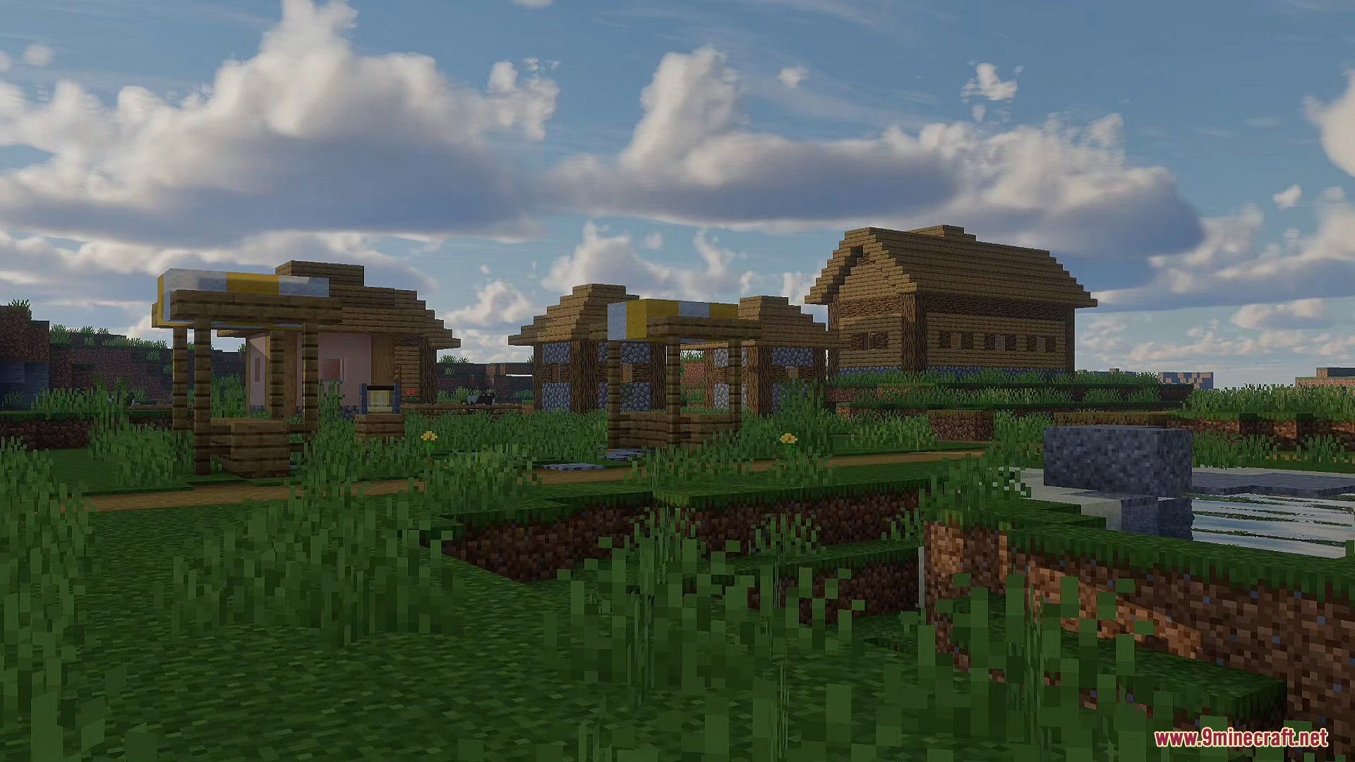 A village with realistic lighting and volumetric clouds under a bright blue sky
