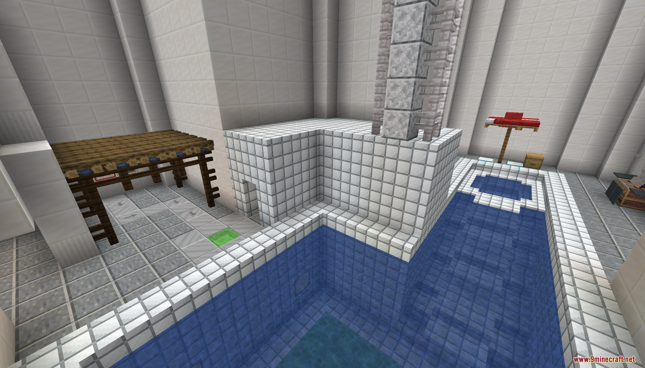 An indoor swimming pool with a central stone pillar