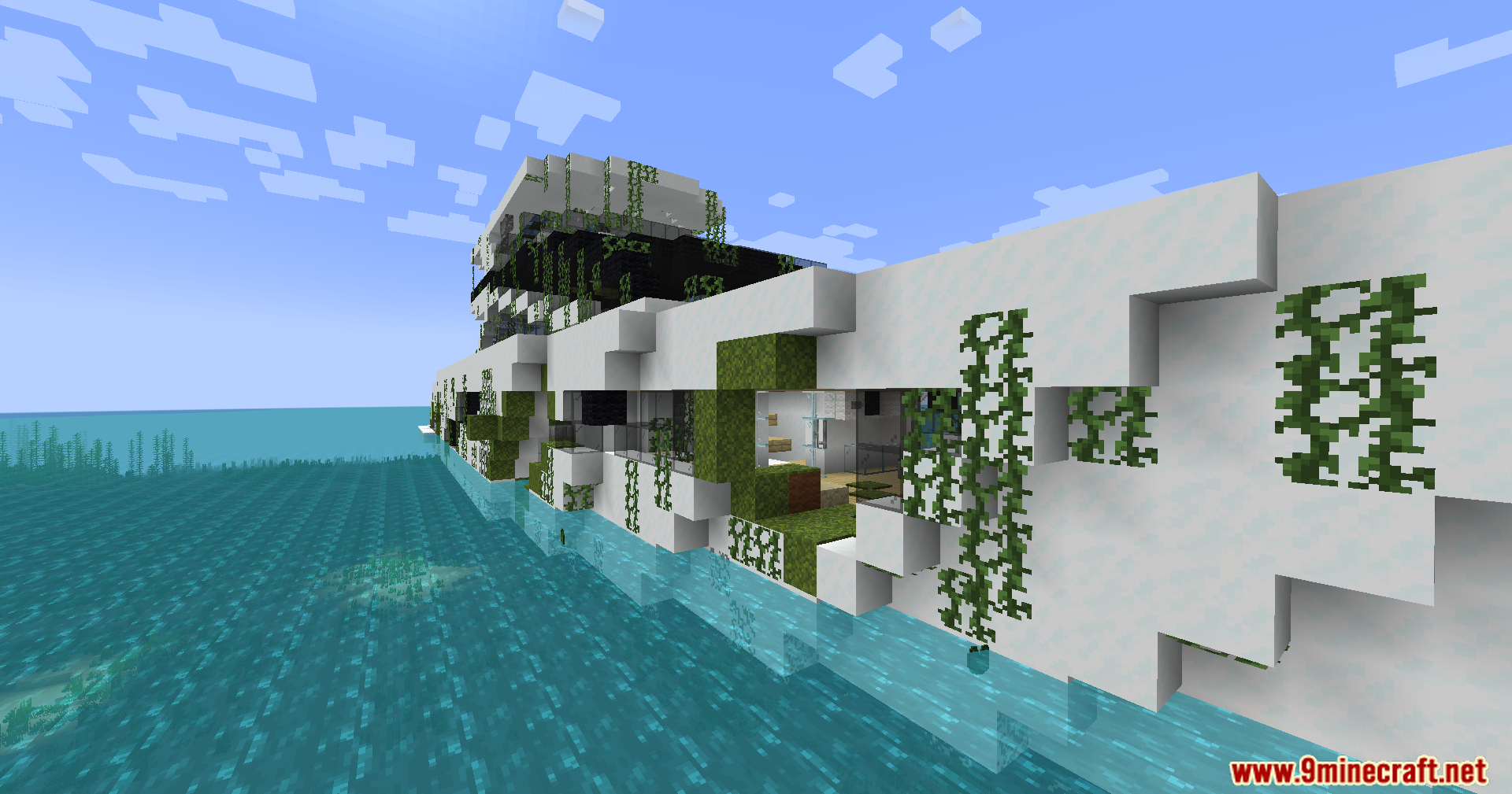 The overgrown hull of a modern yacht in the water