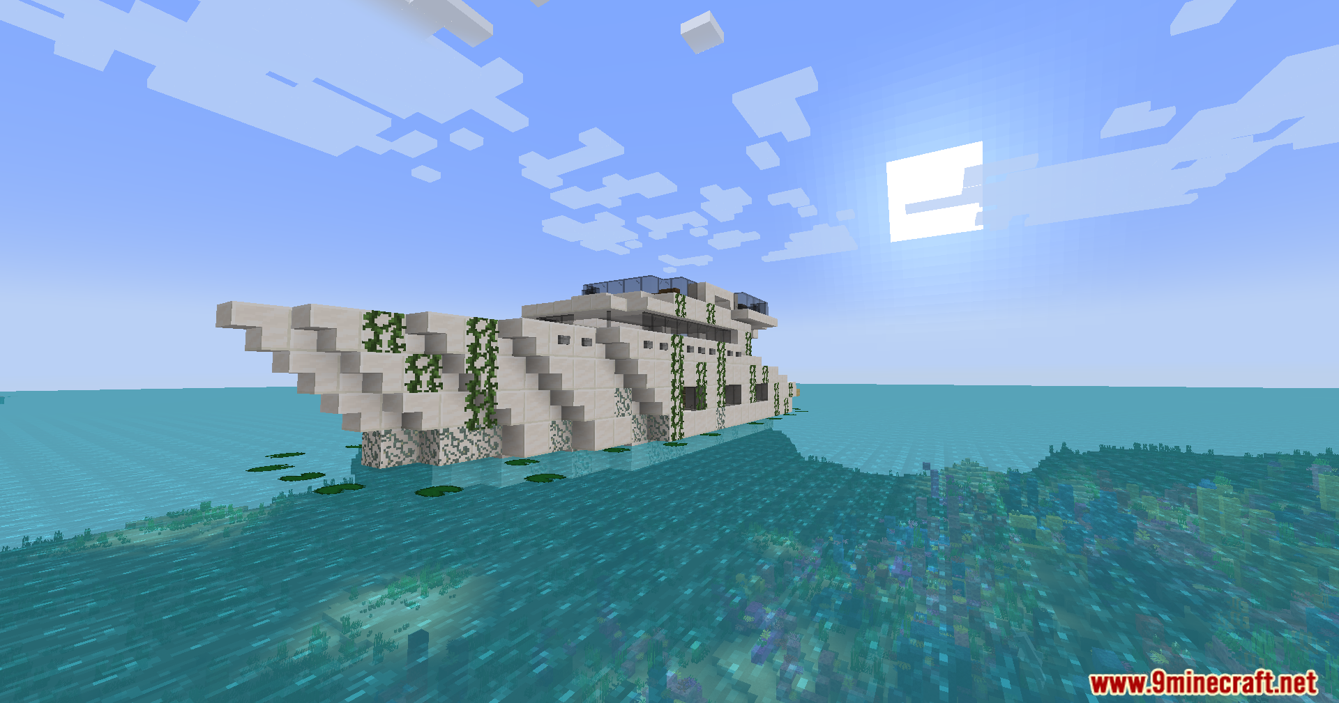 An abandoned yacht structure overgrown with vines in the ocean