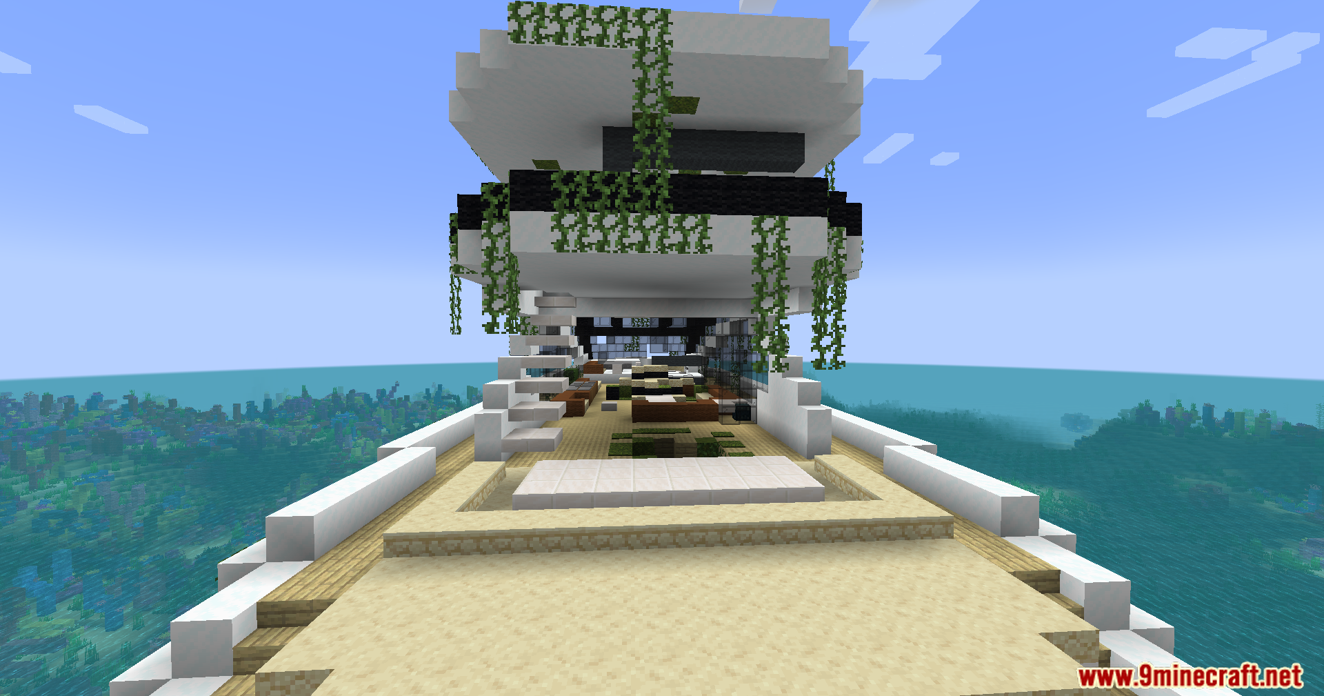 The top deck of the yacht with sand and lounge chairs