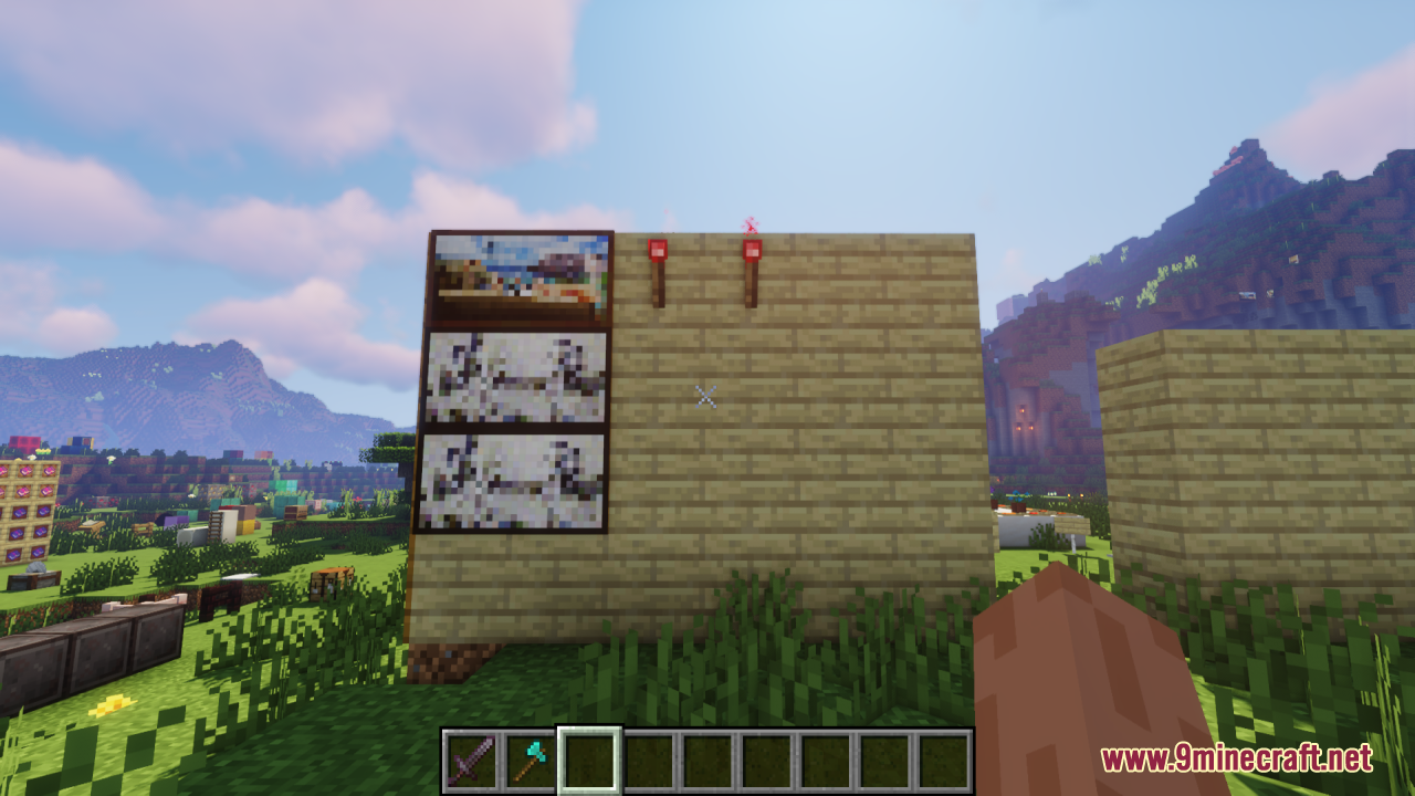 An X-Shaped Crosshair Resource Pack Screenshot 10 Looking at paintings on a wooden wall with the custom crosshair