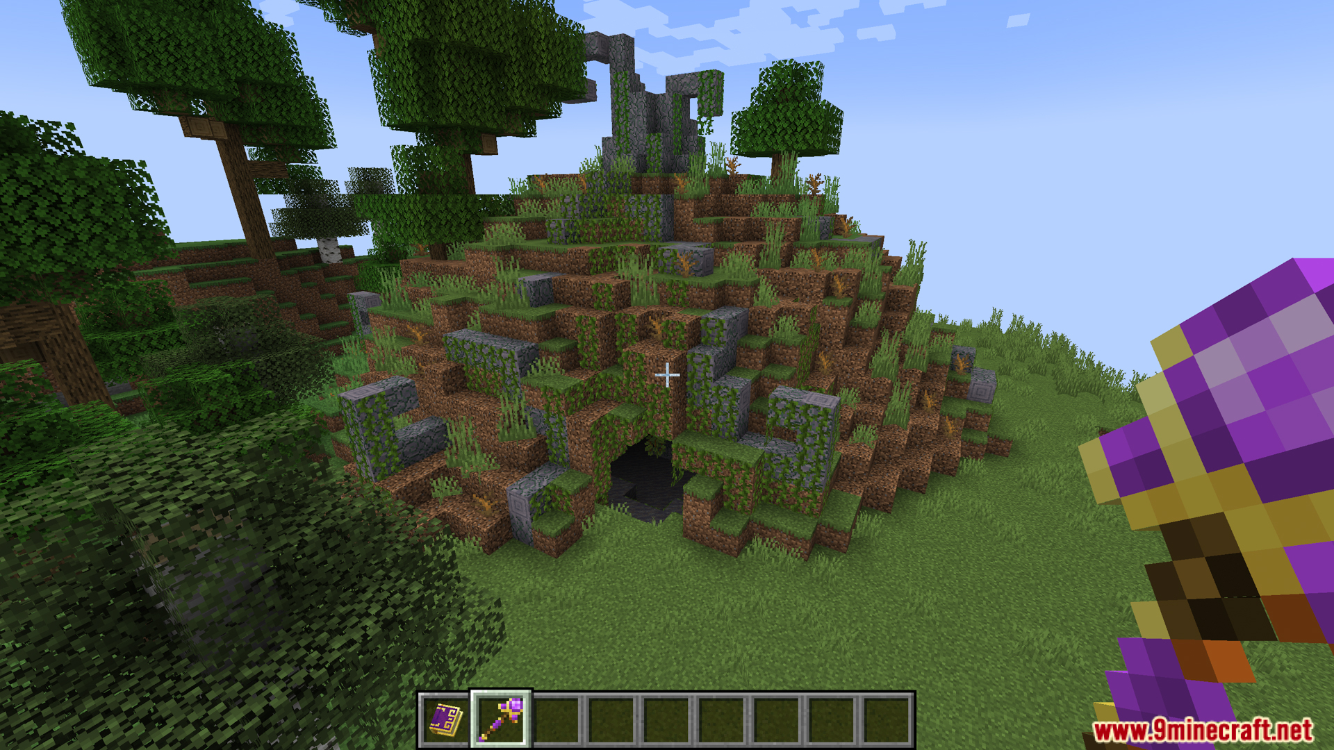 Arsthread Expansion Mod Screenshot 9 A grassy hill with a cave entrance in Minecraft