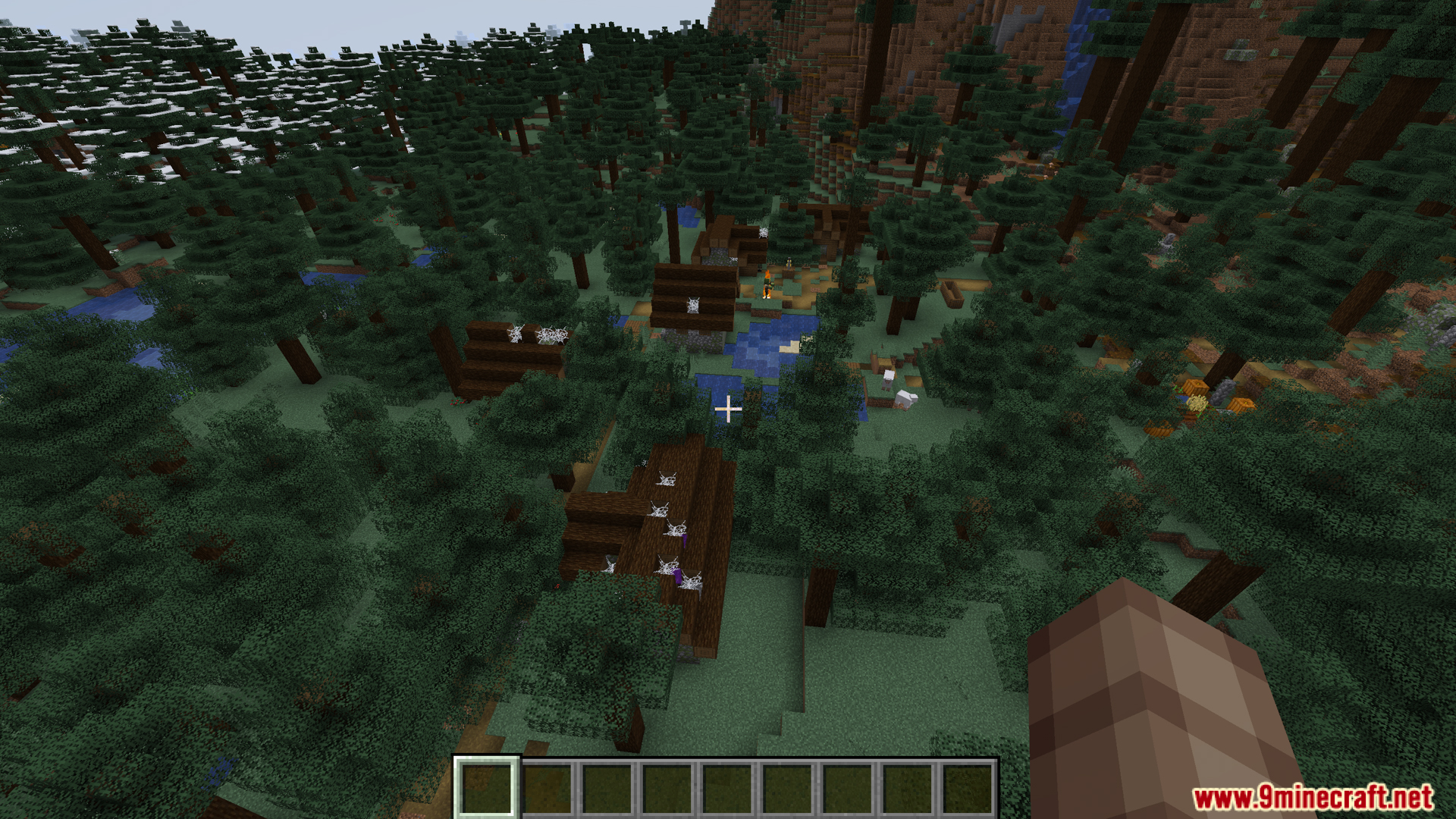 Player falling from high above a spruce forest village area