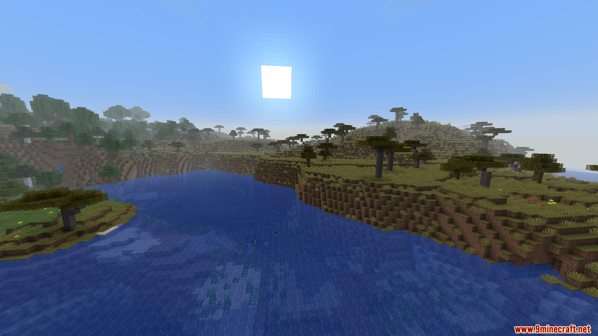 Savanna biome meeting grassy hills near a river and ruined portal