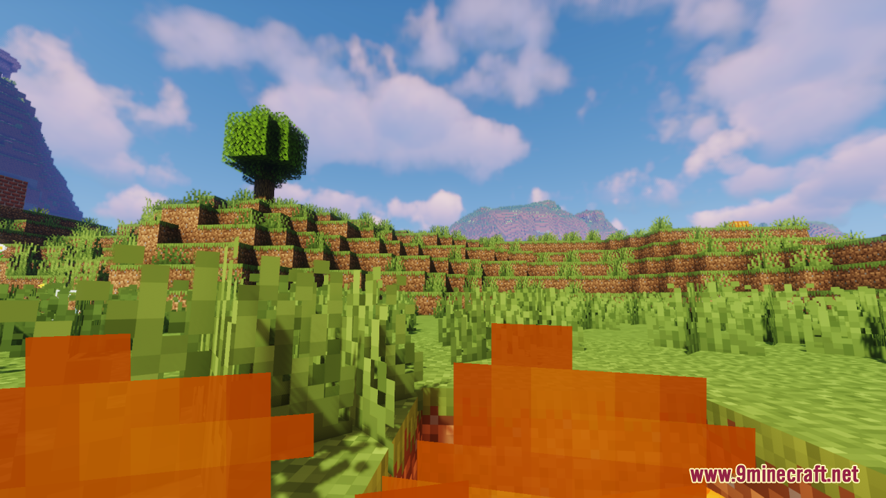 First person perspective with low flames looking at a grassy hill