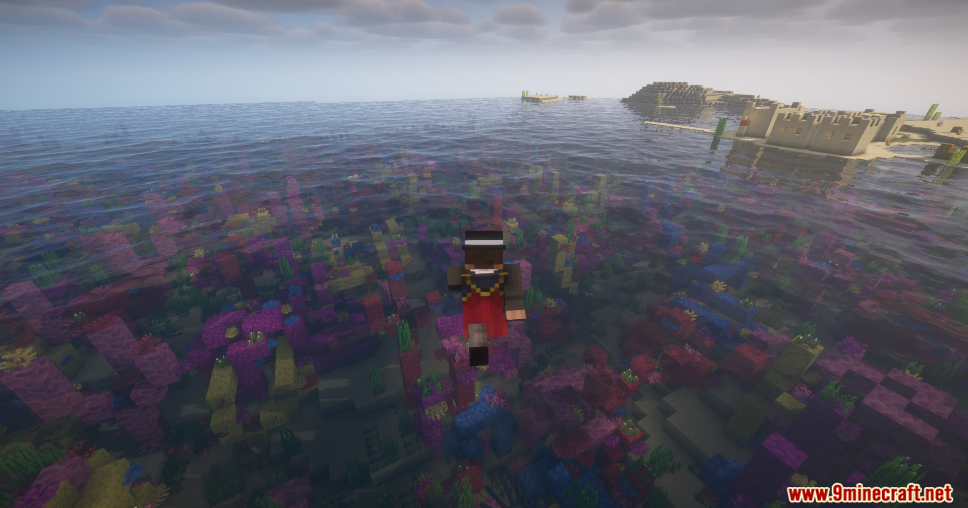 Player flying over a colorful coral reef in a warm ocean