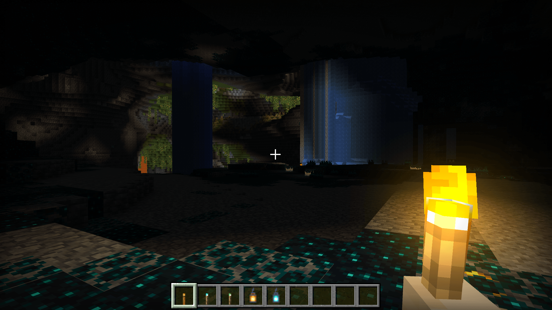 Player holding a torch in cave with Bloomy Dynamic Lights