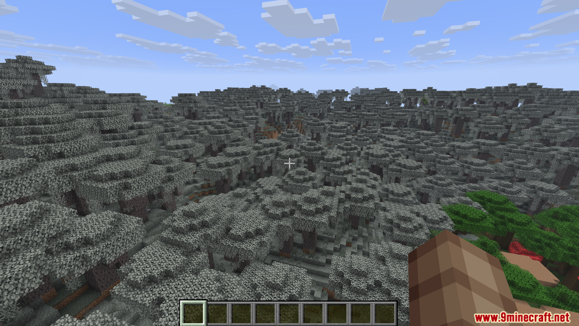 Vast landscape covered entirely in gravel blocks forming hills and valleys