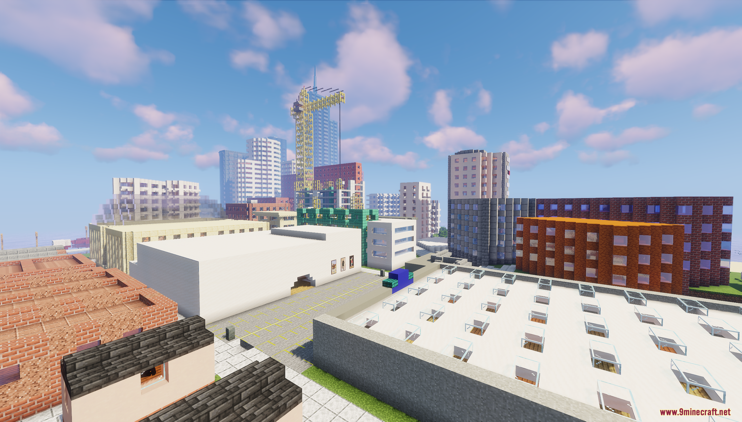 City skyline featuring various buildings and a yellow construction crane