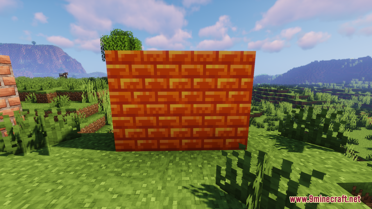 Wall of orange brick blocks with a smooth sculpted clay look