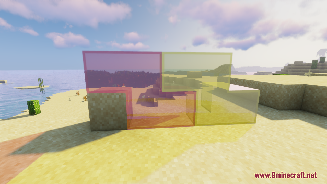 Purple and yellow tinted glass blocks on a beach