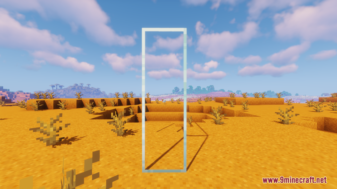 A tall, clear glass rectangle in the desert