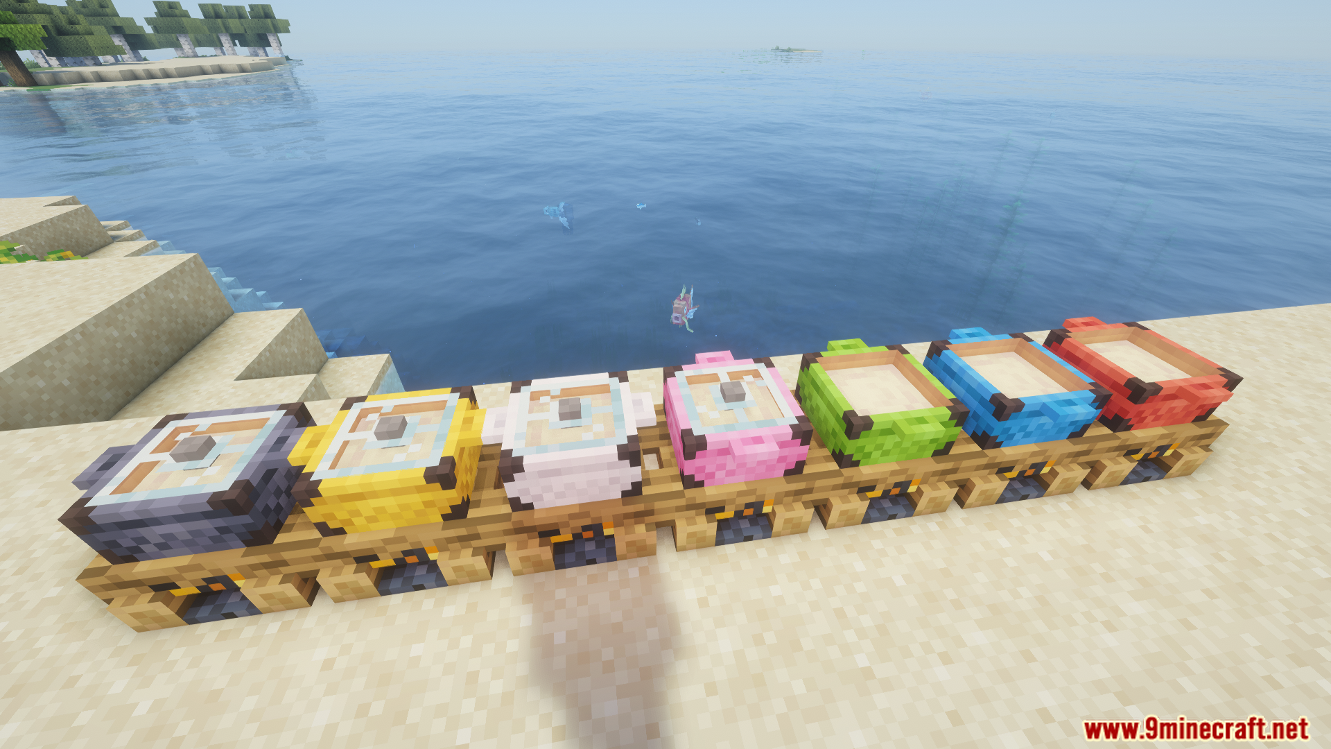 Multiple tiers of colorful campfire pots lined up on the beach