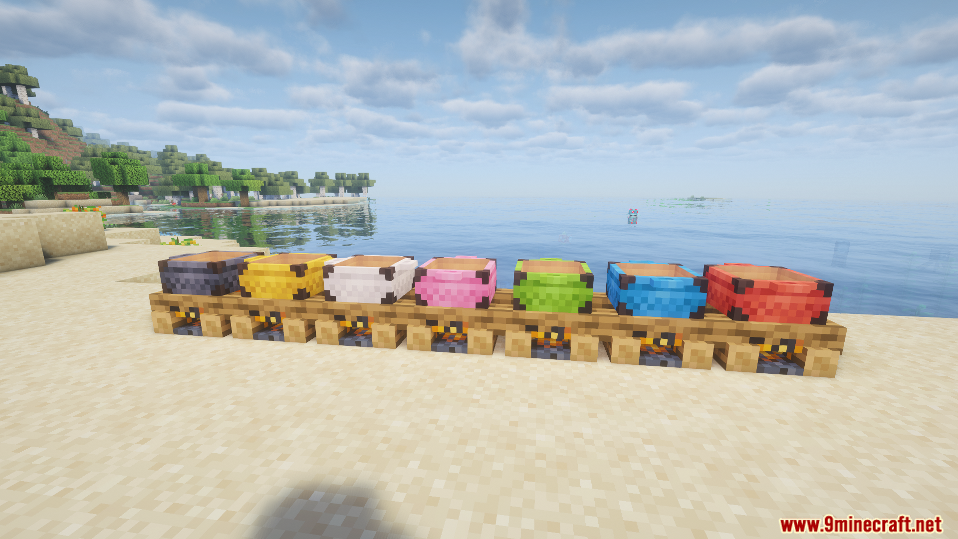 Multiple colored campfire pots placed on top of lit campfires