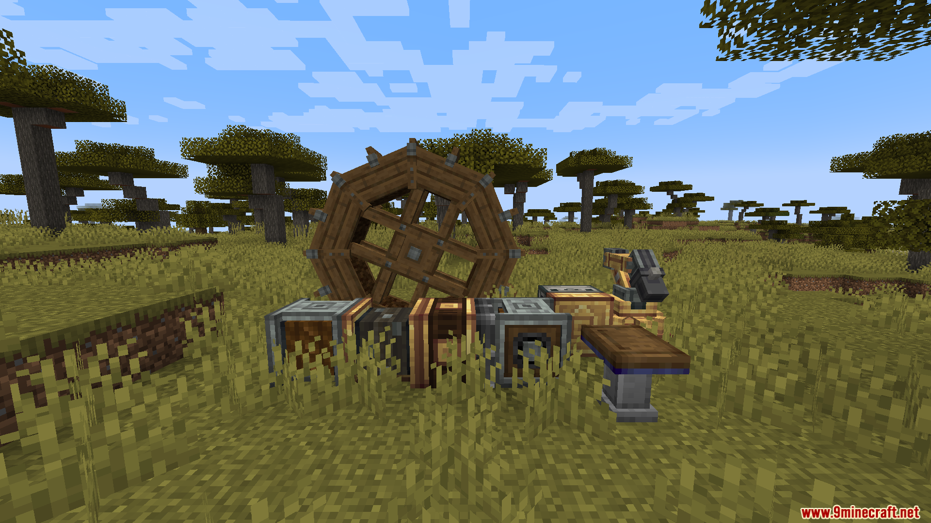 Wooden water wheel connected to gearboxes and a mechanical arm