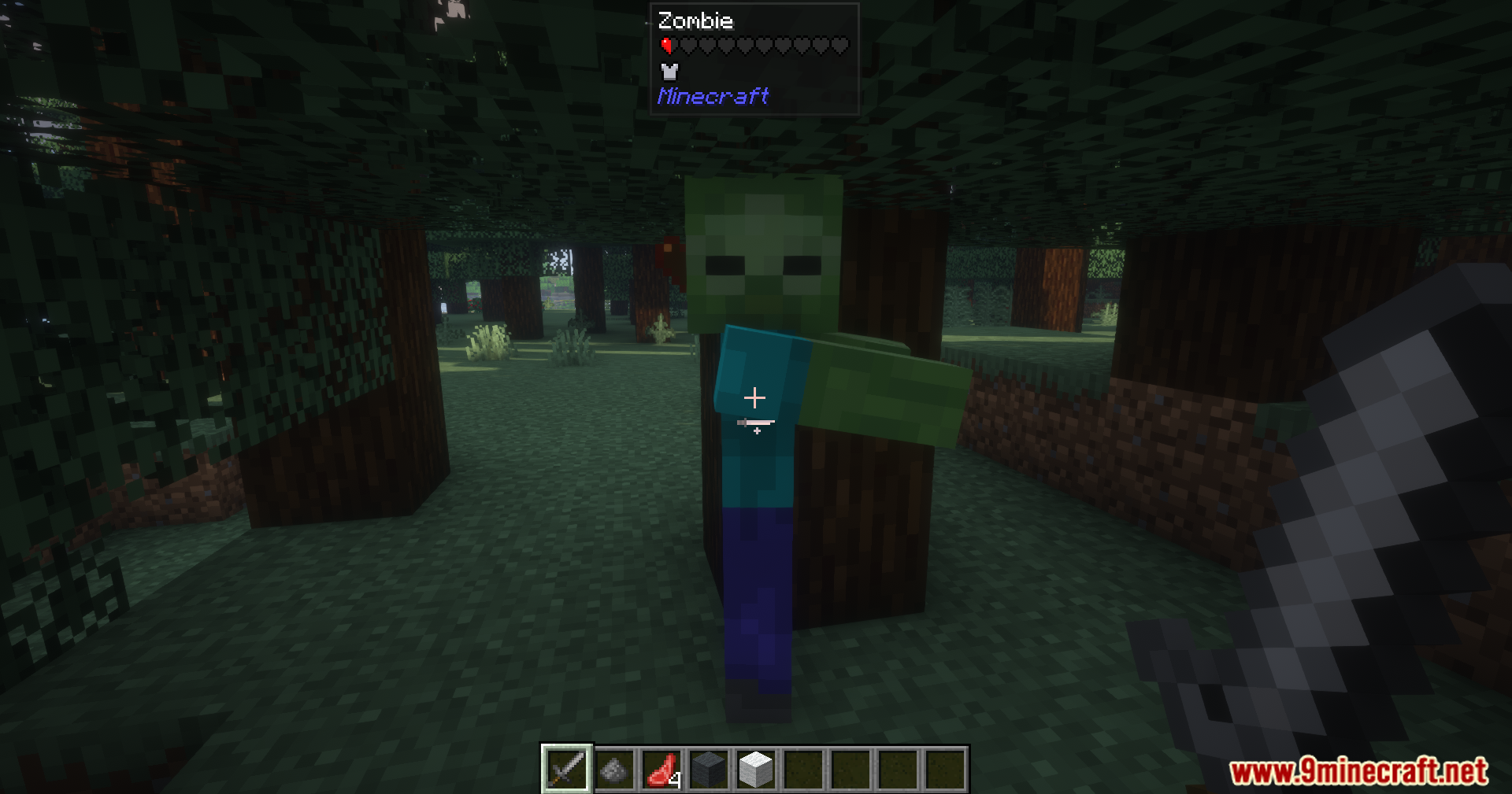 A regular green zombie stands in a dark forest