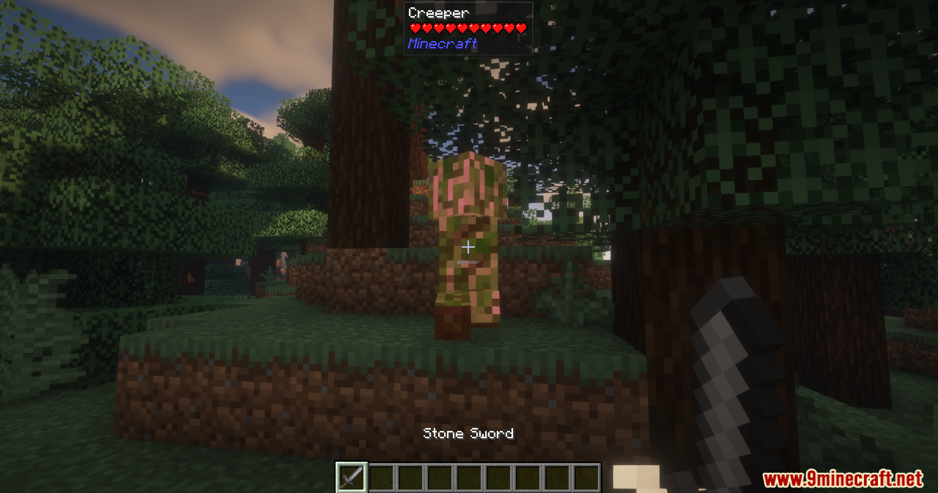 Player confronting a Creeper with a stone sword
