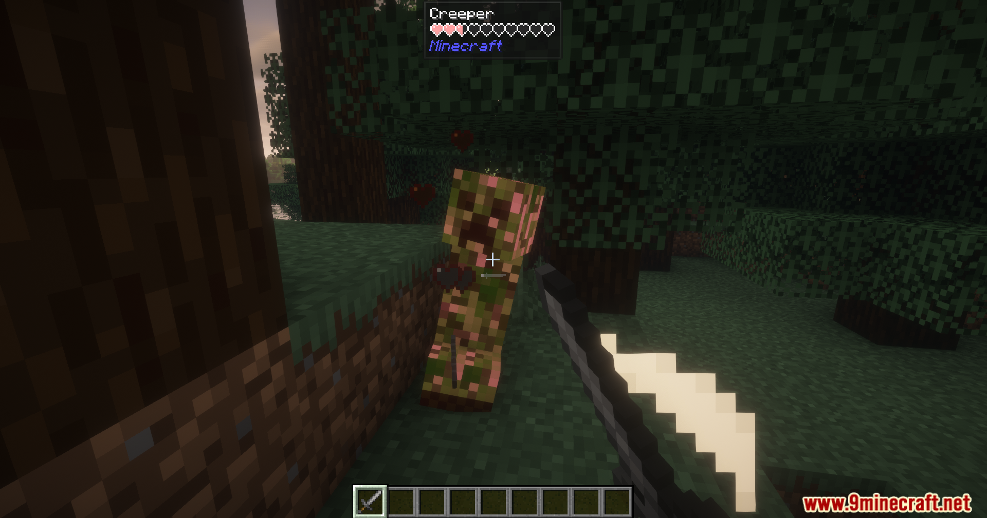 Player defeating a Creeper in a dark forest