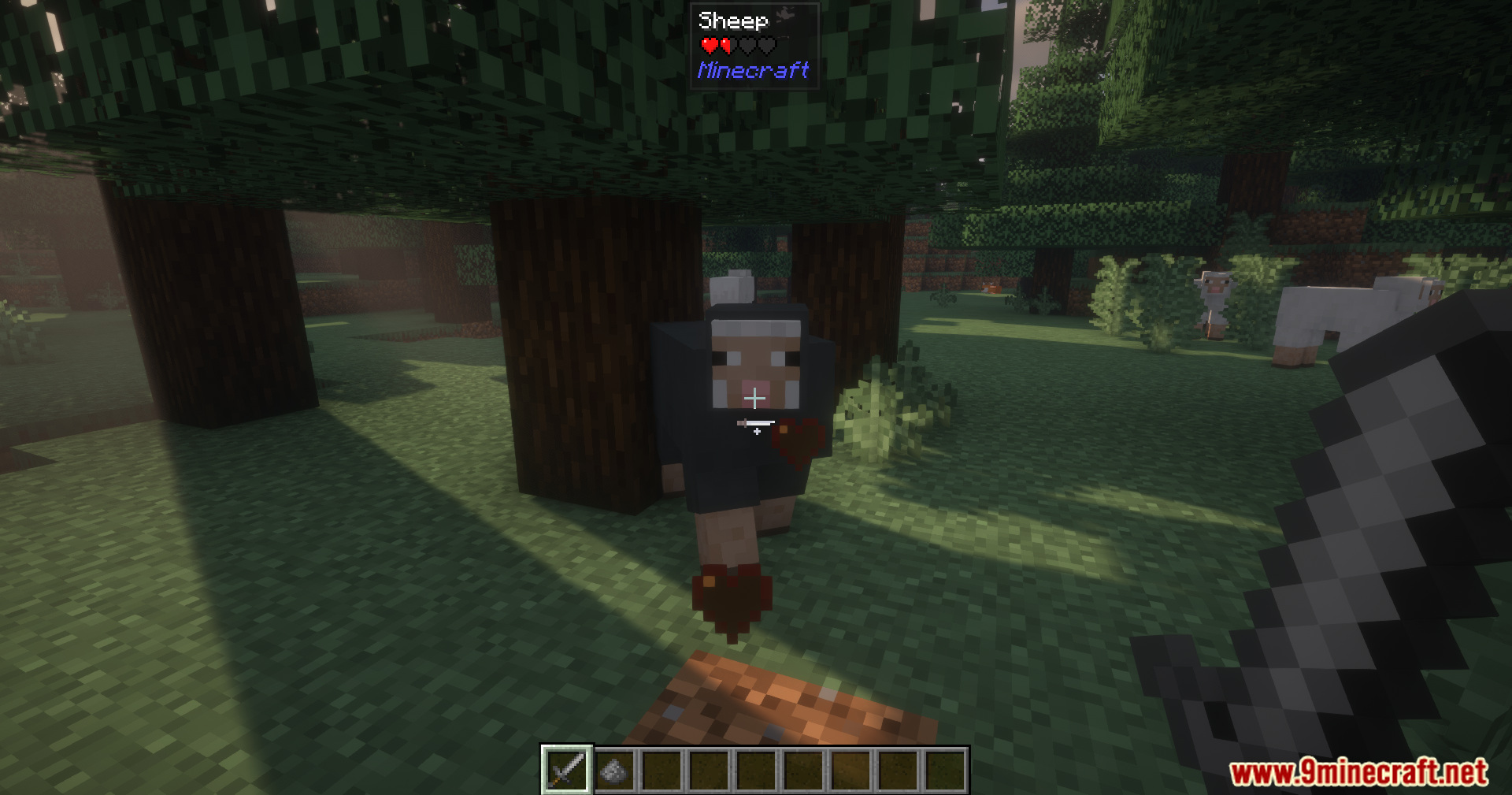 A modded sheep wearing clothes stands under a tree
