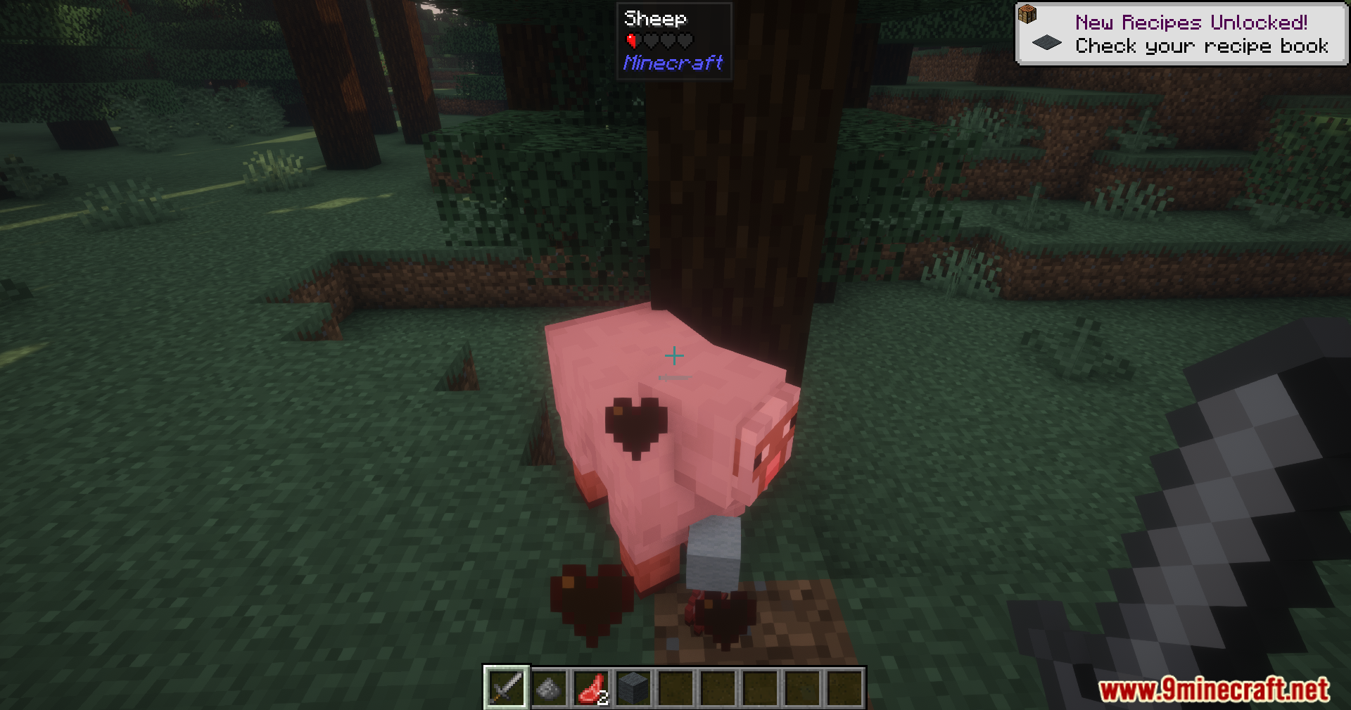 A pink mob with a black heart symbol on its back
