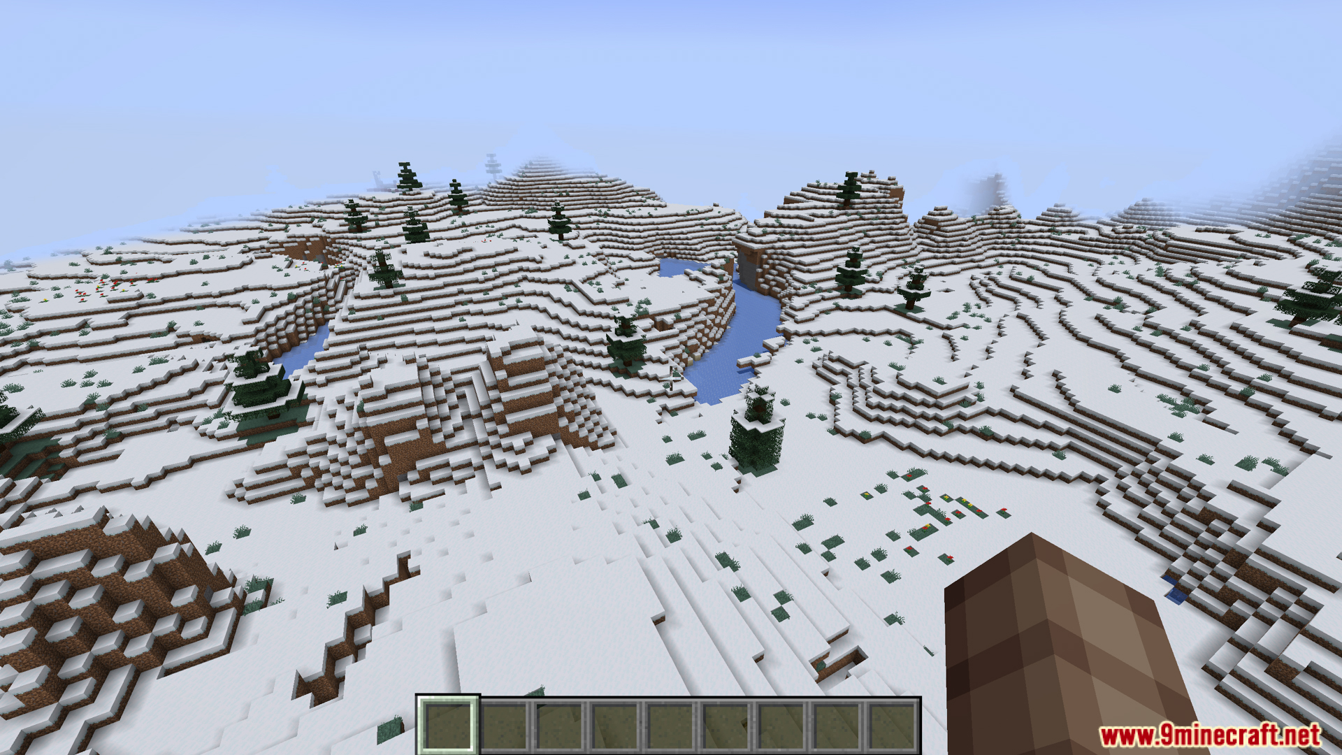 Snowy landscape view in Minecraft without the compass ribbon displayed