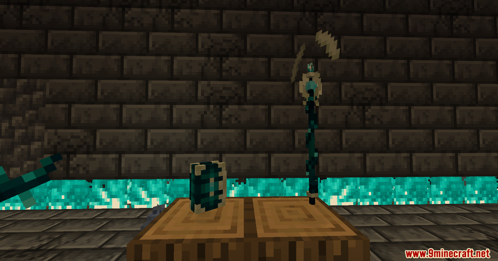 A close up of the new magic staff and spellbook