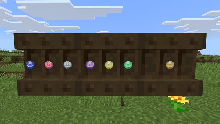 Detailed Pokedrock Addon Mod Screenshot 4 Collection of colorful round items displayed on dark wooden blocks