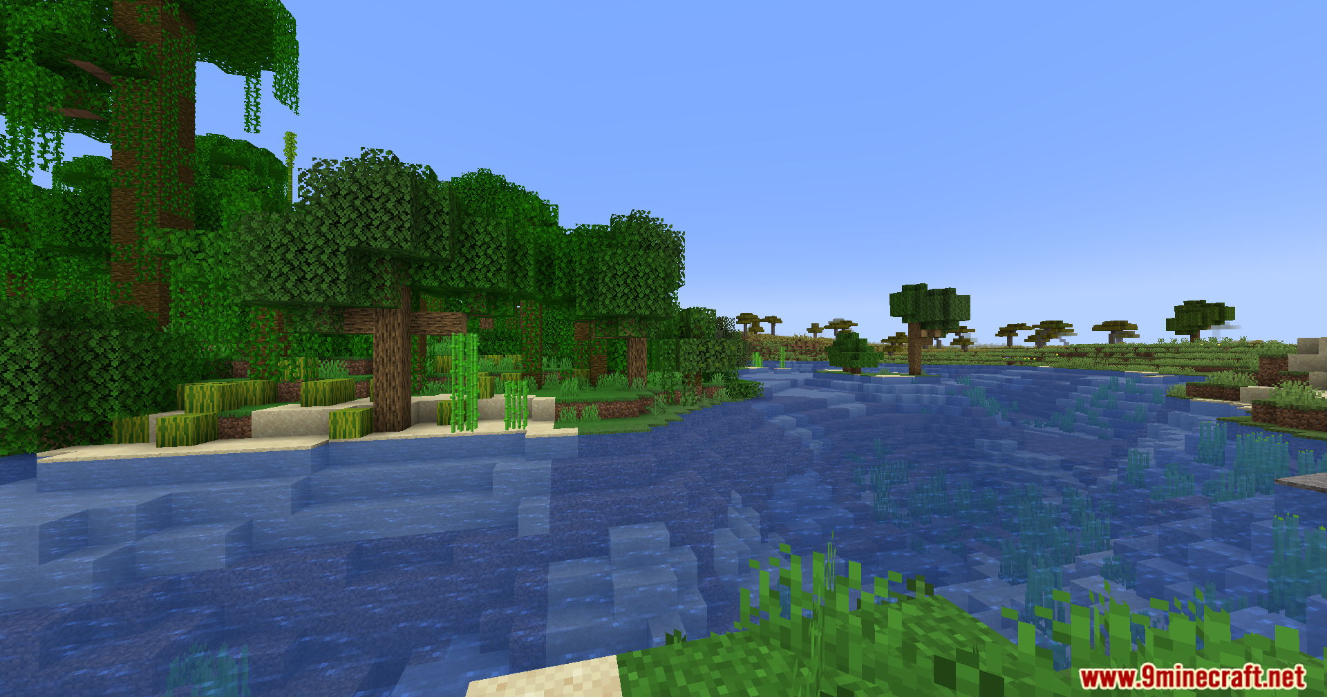 Scenic river landscape separating jungle and savanna biomes in Minecraft