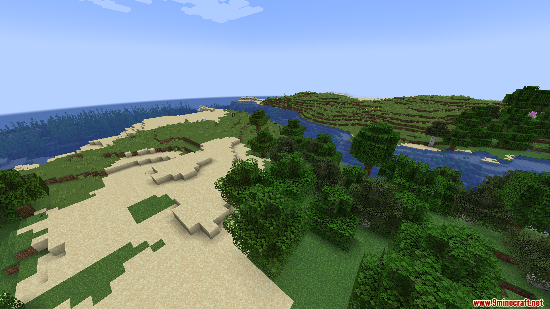A standard Minecraft landscape view with a river sand and trees