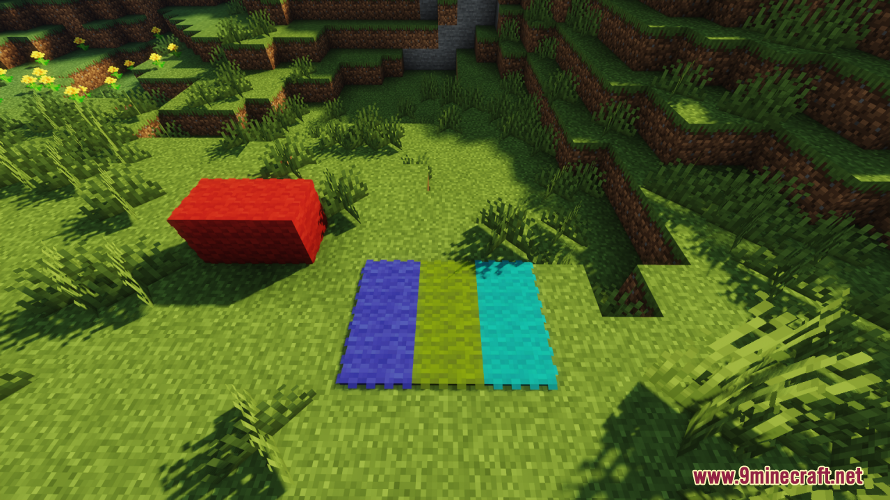 A red wool block and three fluffy carpets on grass