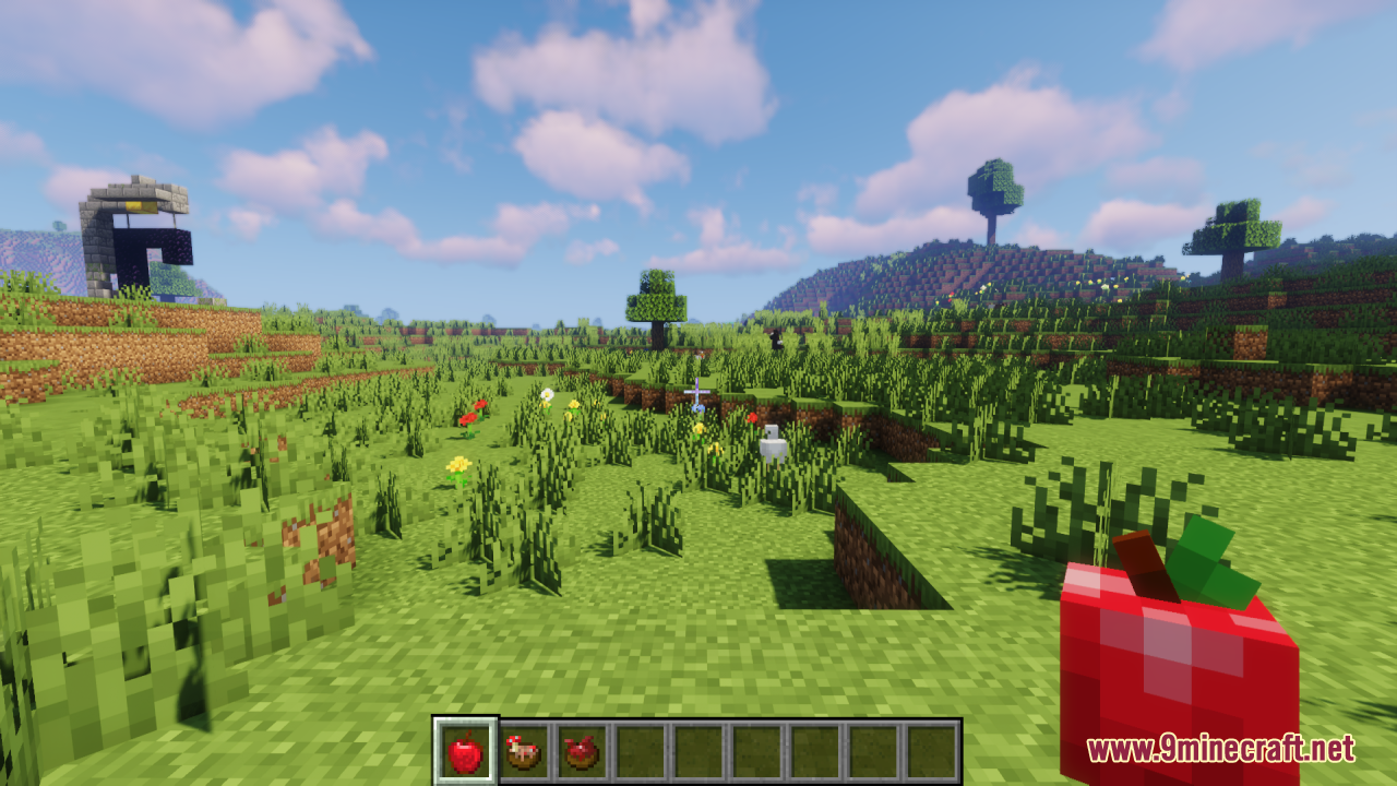 First person view of player holding a 3D red apple