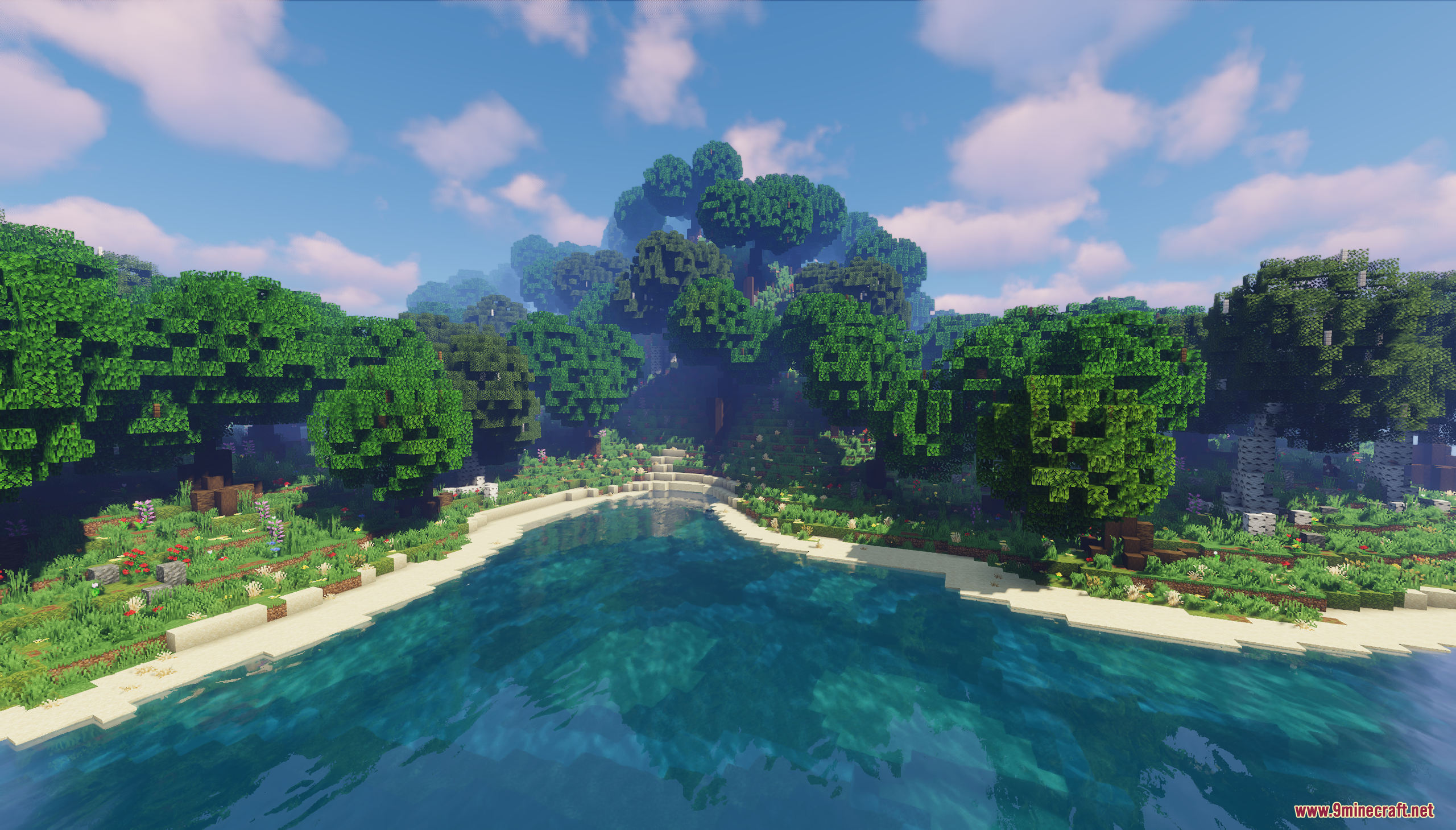 Lush green custom trees growing along the sandy shore of a lake