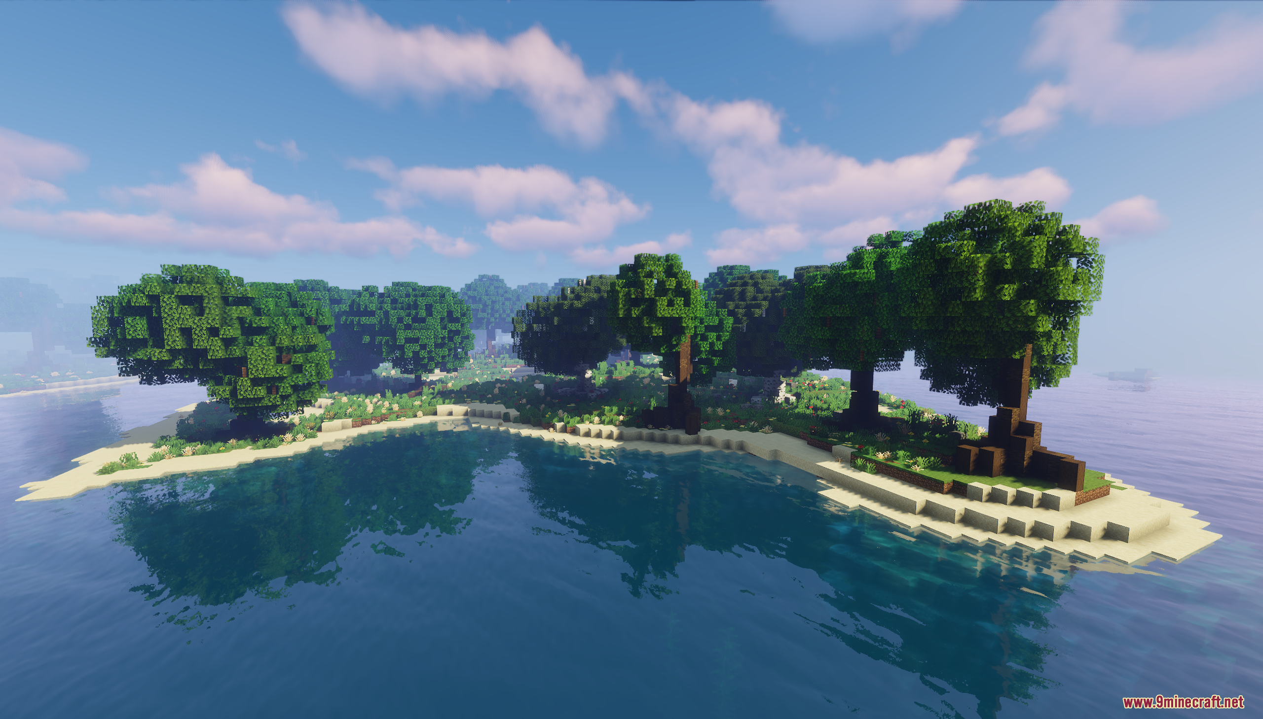 A small island with trees and a sandy beach