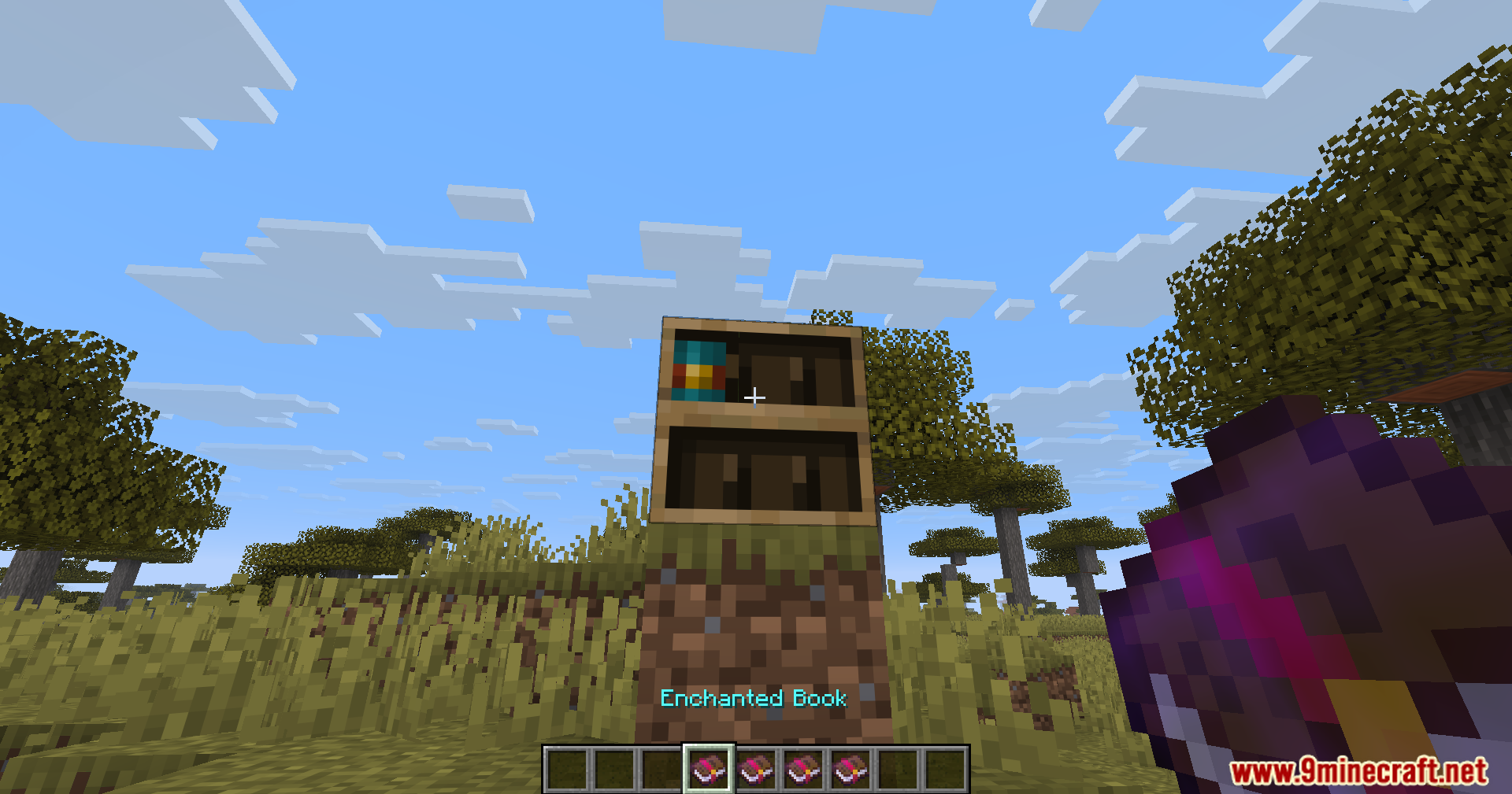 Player placing an enchanted book into a chiseled bookshelf block