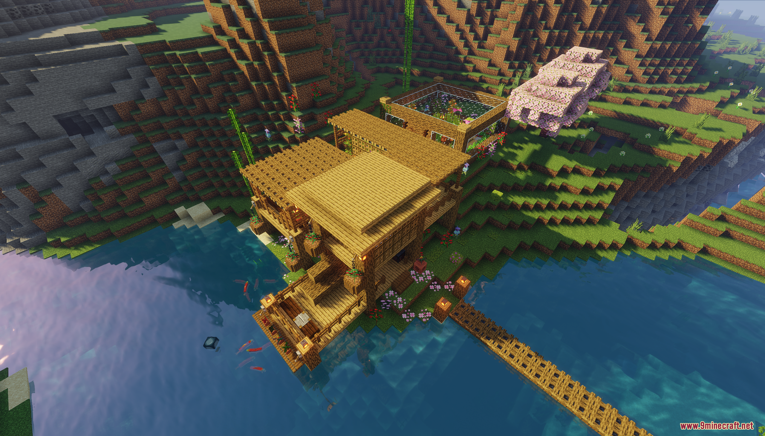 A multi-level wooden house built on the edge of a river