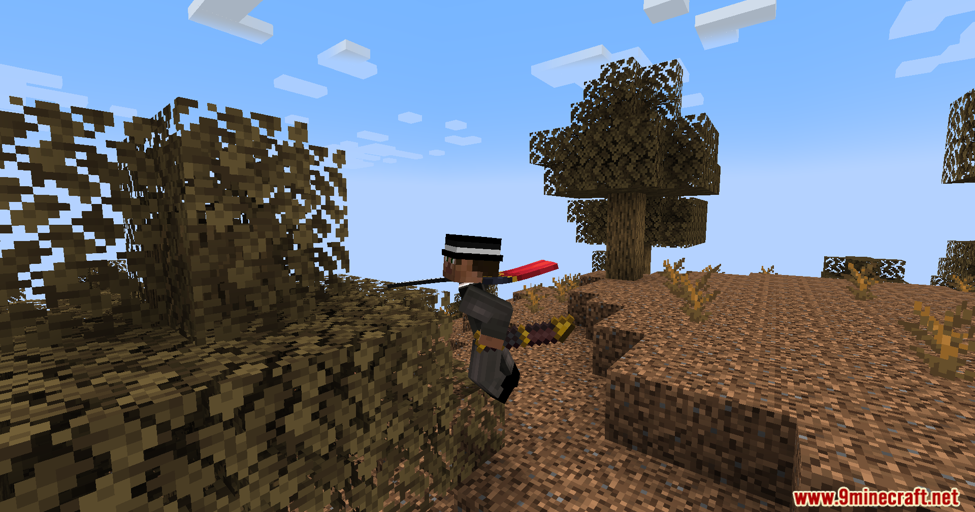 Side view of player running with a sword in wooded badlands