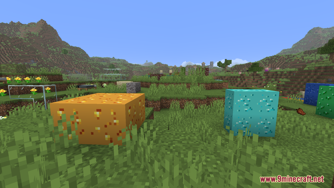 Large glowing gold and diamond ore blocks in a grassy area