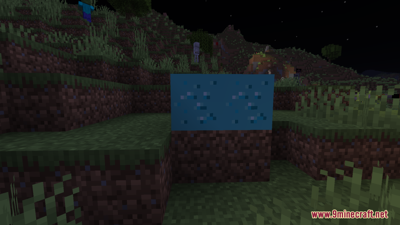 Two glowing diamond ore blocks on dirt at night