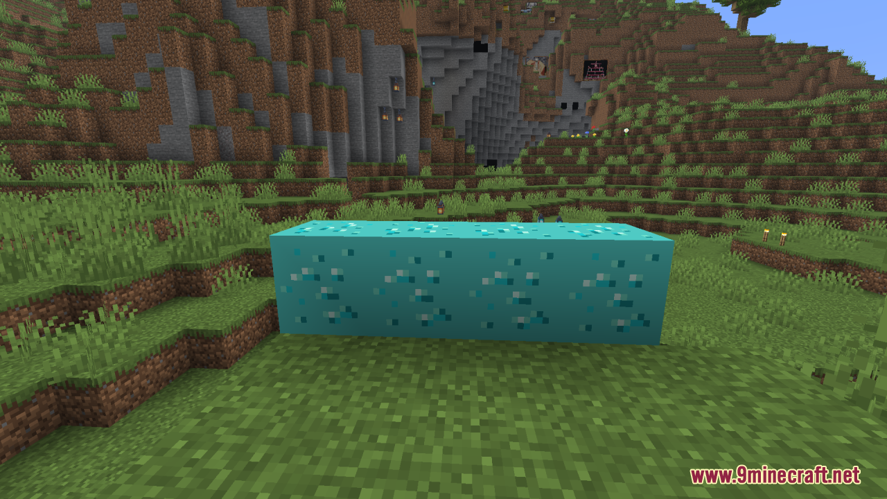 Four glowing diamond ore blocks on grass in daylight