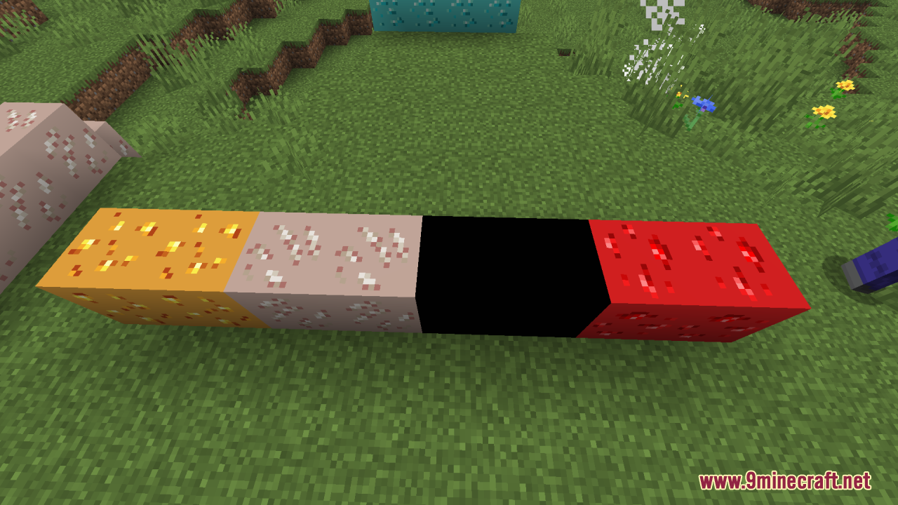Row of brightly colored glowing ore blocks placed on grass