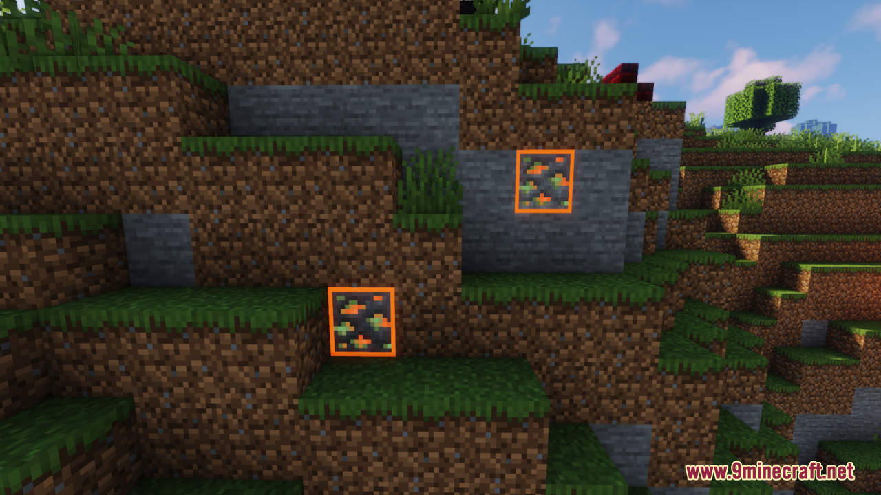 Two glowing copper ores visible on a grassy dirt cliff face