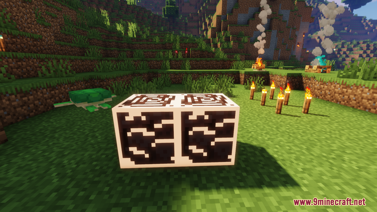 Glowing ancient debris blocks placed near a sea turtle and torches