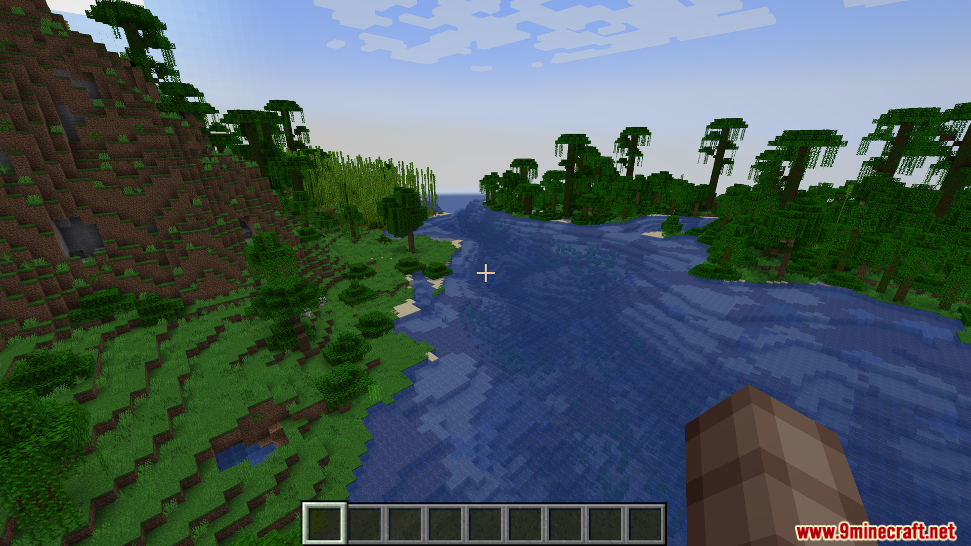 Gtceu Terminals Mod Screenshot 2 Player looking at a river between a jungle and grassy hill