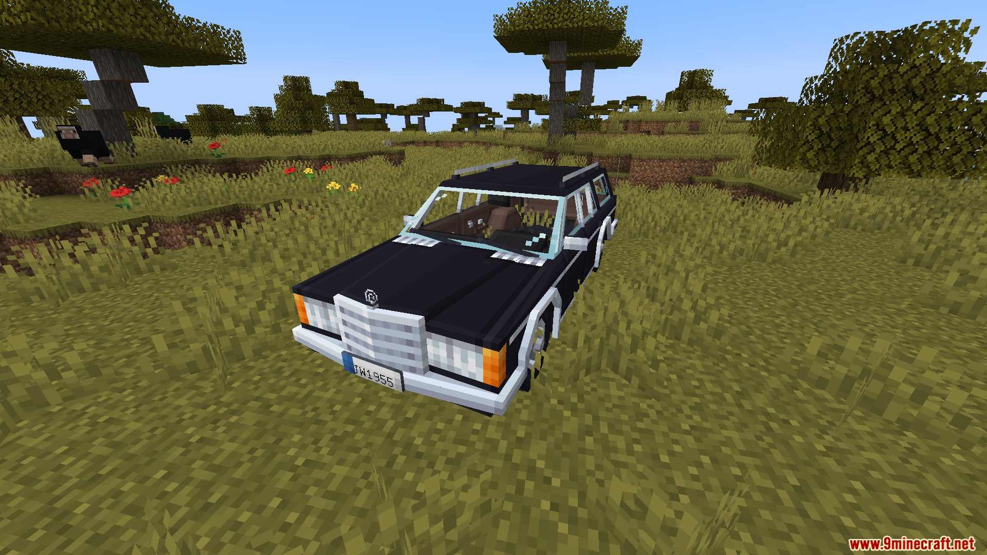 Black station wagon parked in grass from Immersive Vehicles mod