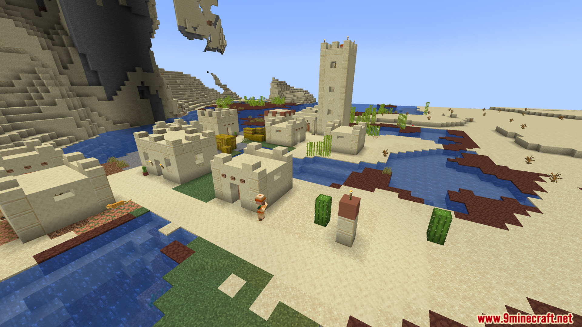 A peaceful desert village located next to a winding river