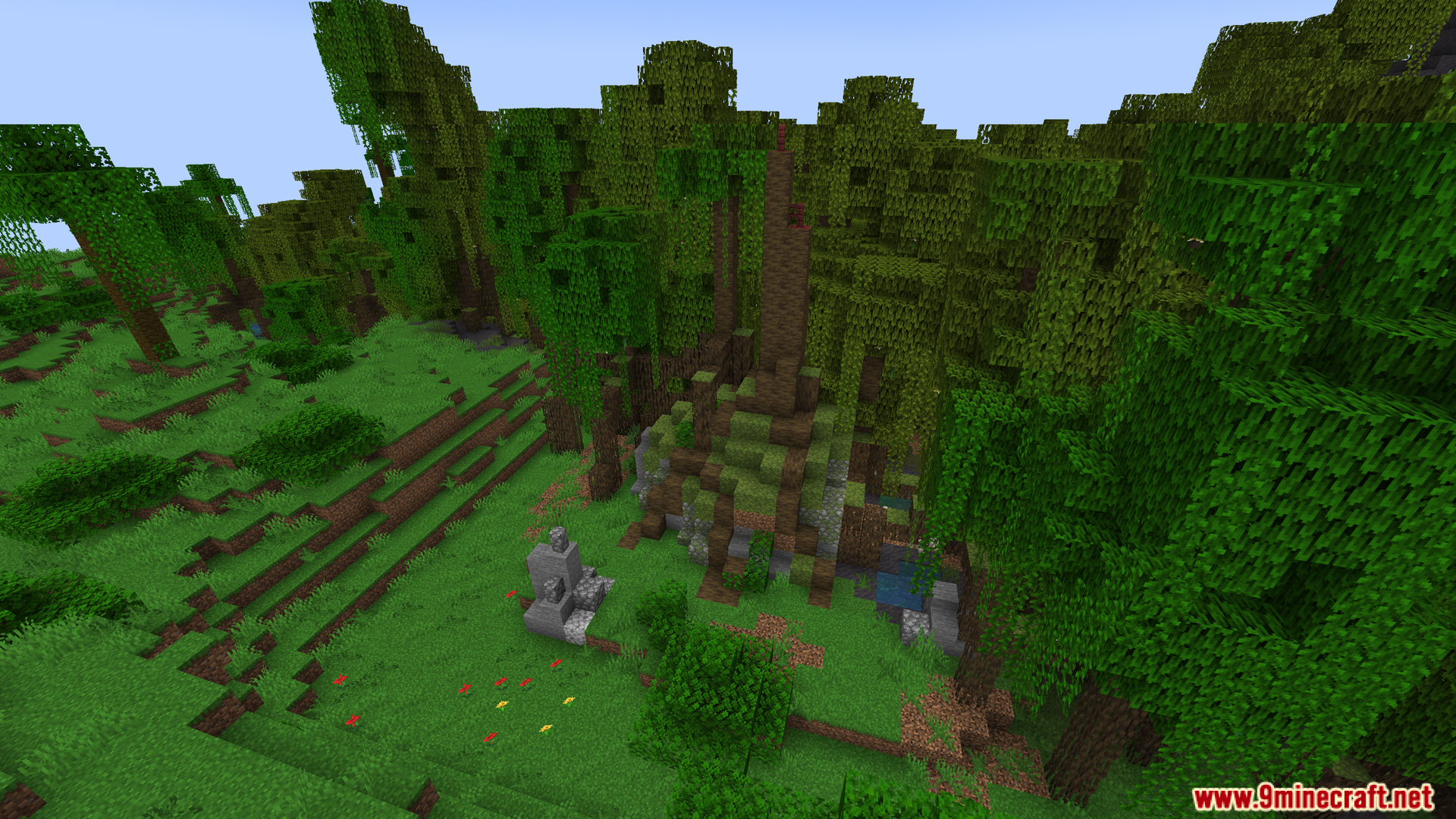 Small stone ruin next to a tall dirt jungle spire