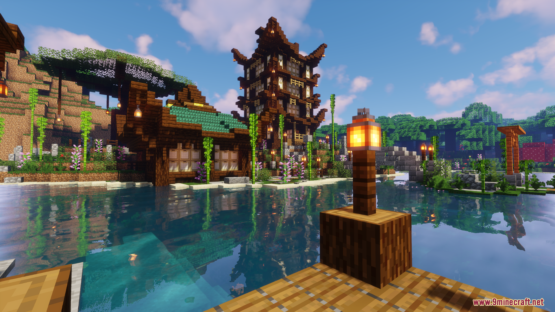 Wooden dock overlooking traditional Japanese buildings and water reflections