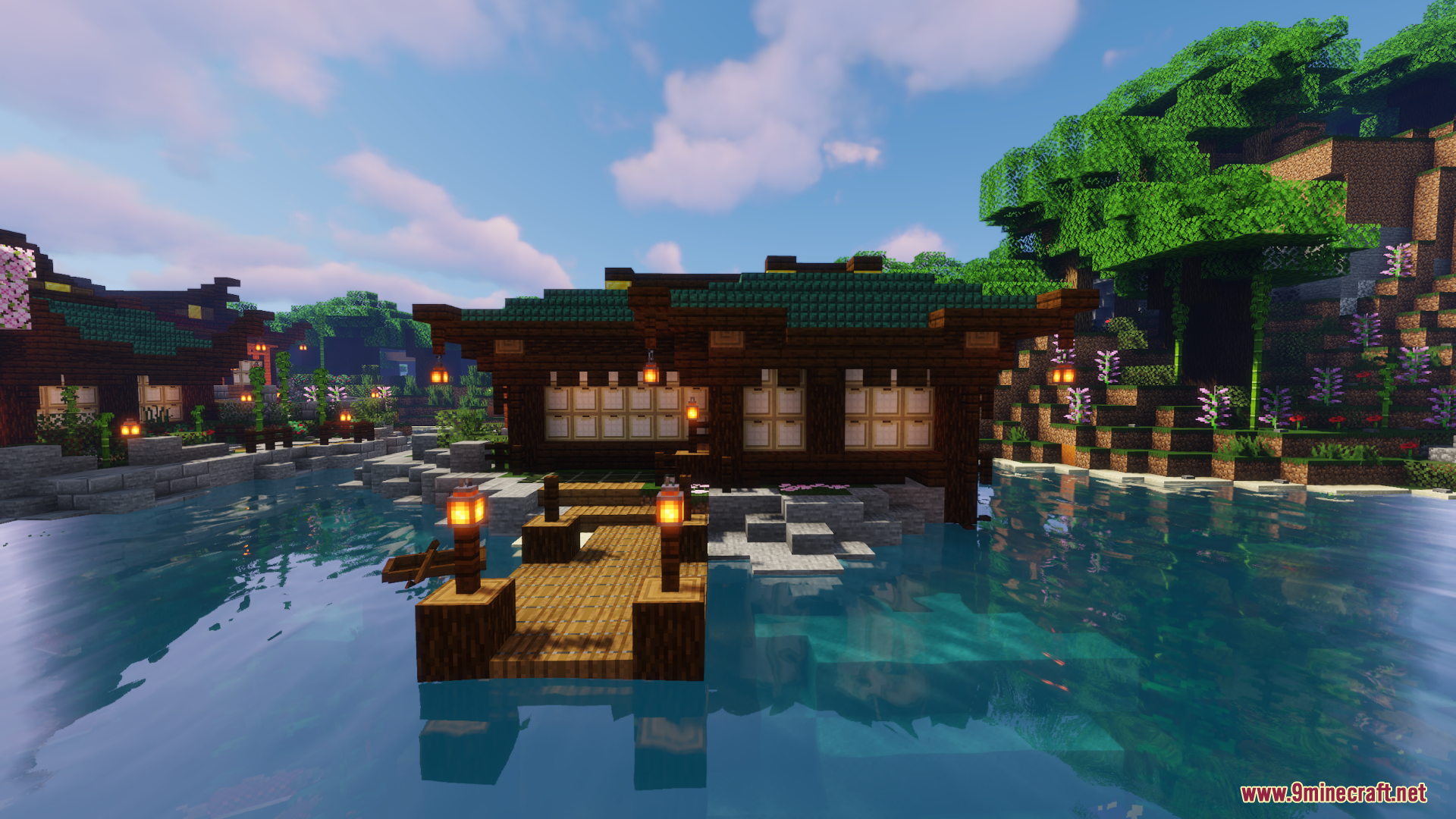 Traditional Japanese style house built over water with a wooden dock