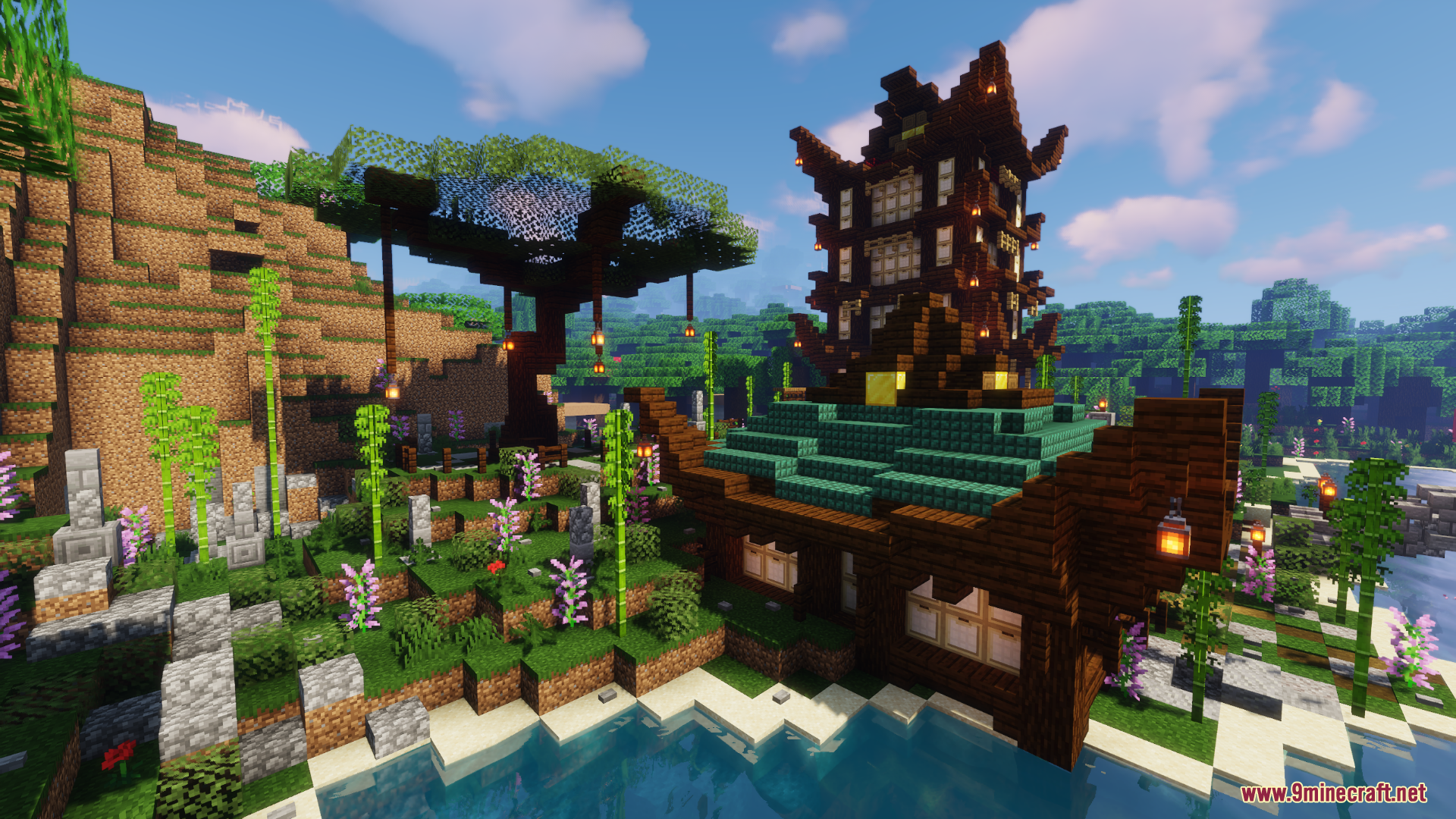 Tall wooden pagoda and green roof house next to bamboo garden